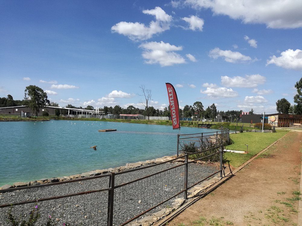 The calm lake at The Waterfront Karen — the “waterfront” is literal, not marketing